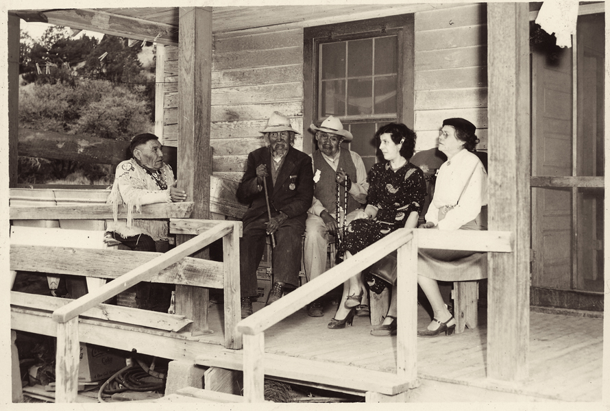 Eve Ball, far right, speaking with three of the tribal elders: (l-r) Percy Bigmouth; Old Scout Bigmouth and Crookneck, c. 1950. Old Scout served in the Geronimo campaigns and was about 100 at this time.