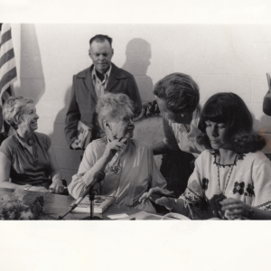 Book signing for Indeh, An Apache Odyssey-1980. Eve, age 90, is at the center seated in the carved Mexican Chair. Co-author, Lynda Sánchez, is on right or Eve’s left side; others were friends attending the presentation. including many Apaches.  