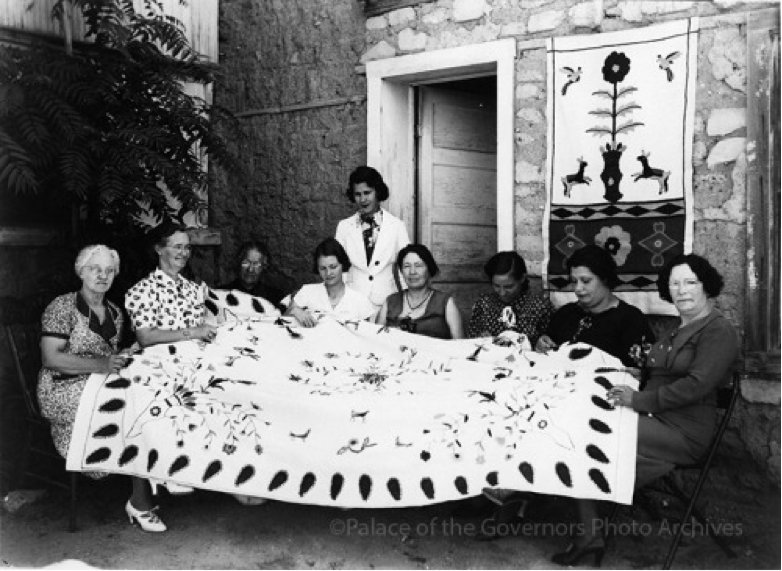 Estella García (standing) and her colcha embroidery class.