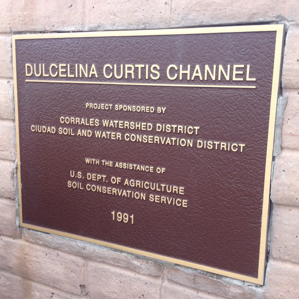 Flood-control channel named in honor of Dulcelina Curtis.