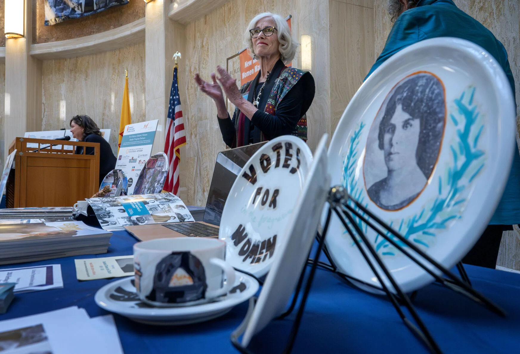 Paula Tackett (center) joins a rally in the Roundhouse Rotunda.
